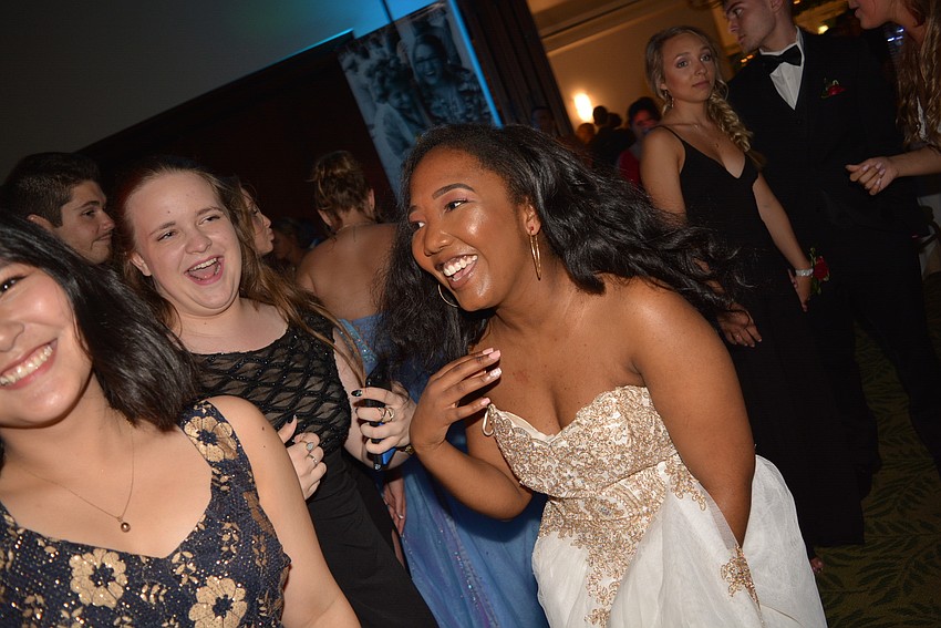 Juniors Victoria Lim, Alexis Theiss and Reina Langley dance after their conga line fizzled.