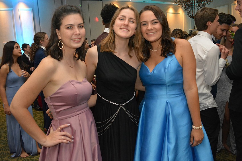 Grace Hill, Courtney Gape and Emma Reinisch, all seniors, say dancing is the best part of prom.