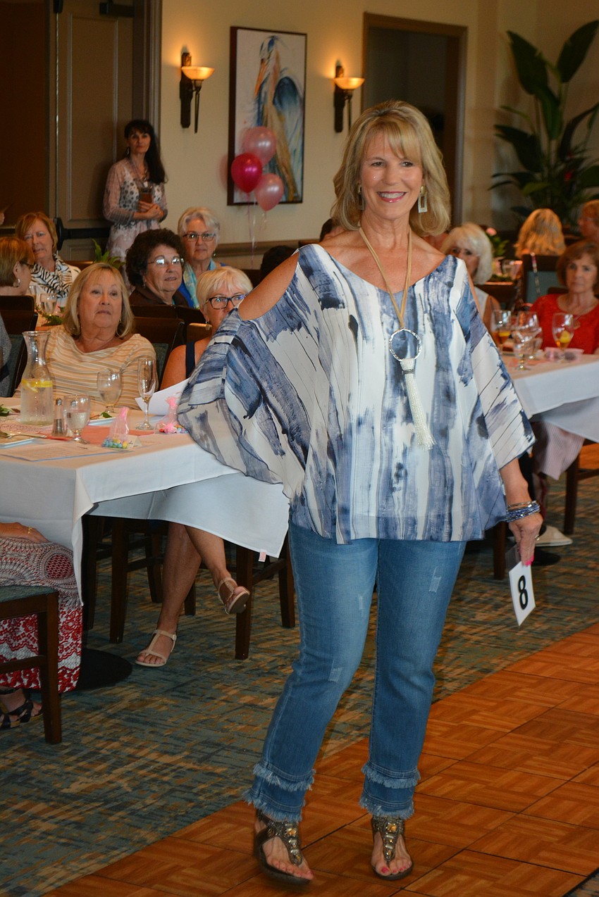 Lisa Vokey comes down the runway, showing off a casual fashion.