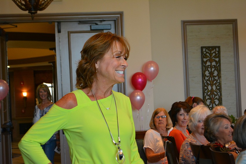 Cindy DiPalma is all smiles as she takes her turn as a model.