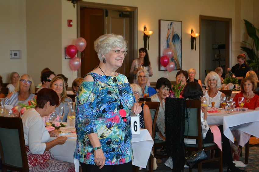Helga Bellmann was bursting with color as she works the room.