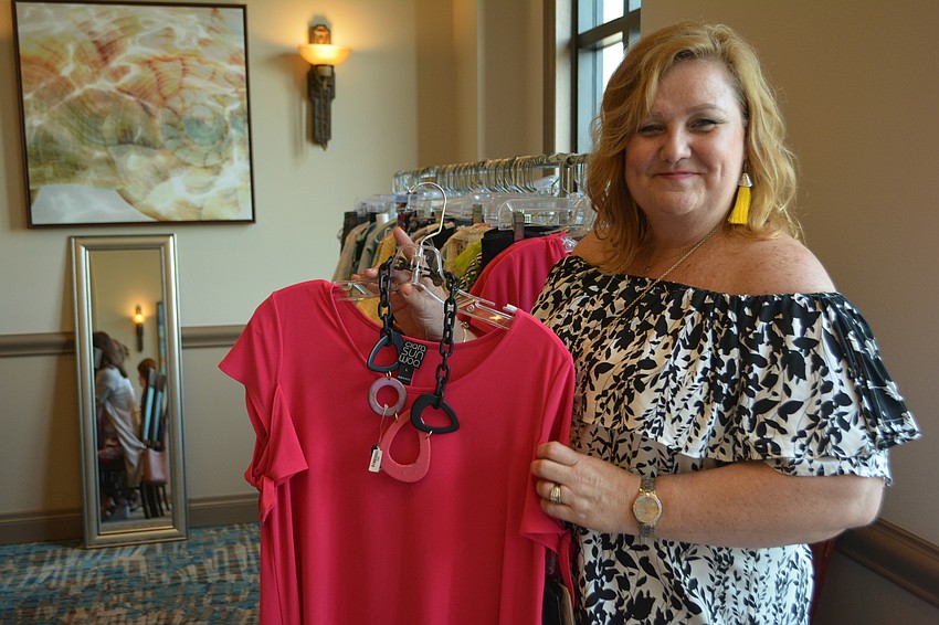 Lisa Charnicharo, owner of Pj's Boutique of Sarasota, shows off summer fashion.