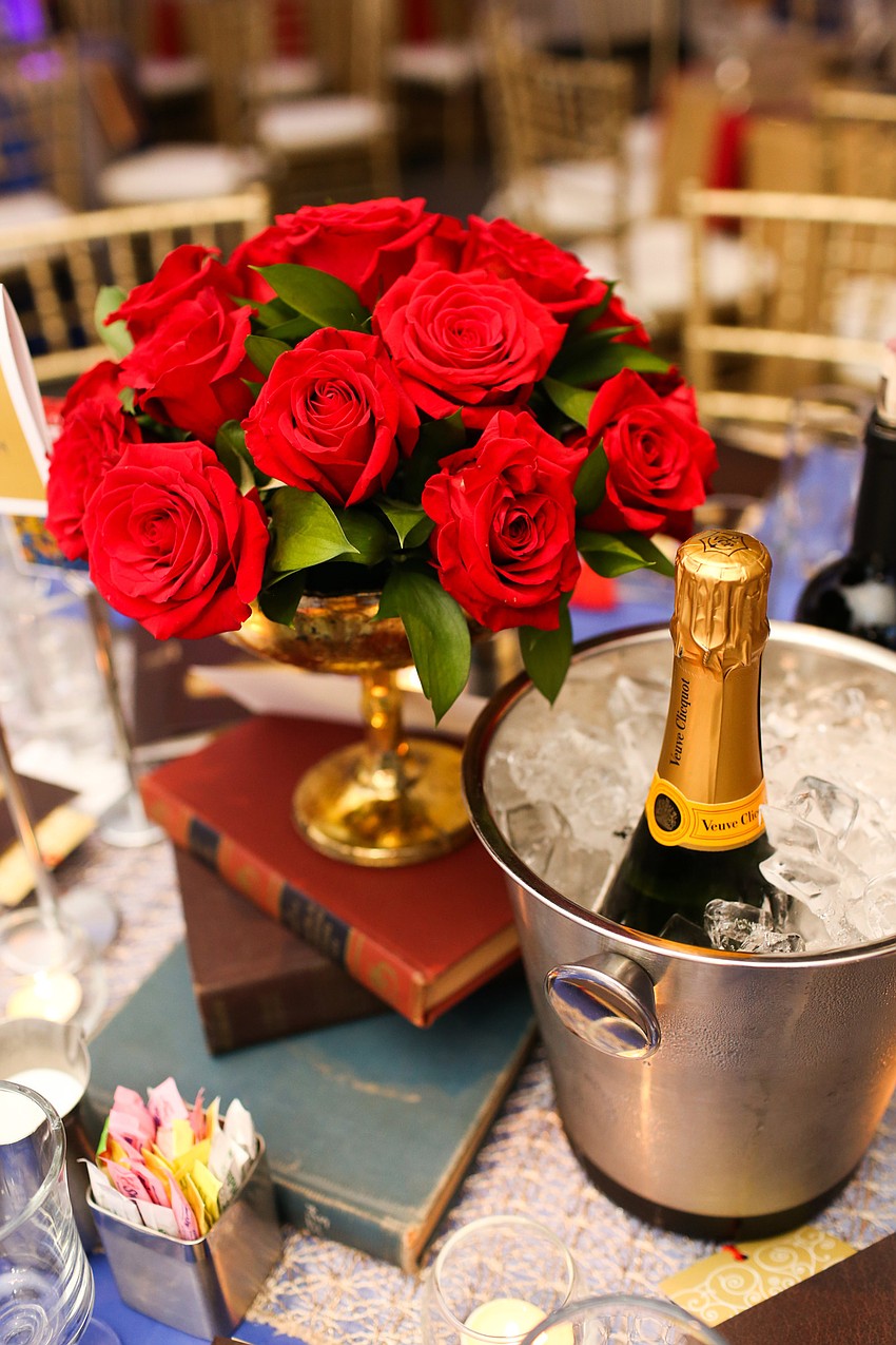 Some of tables had a bottle of Champagne chilling.