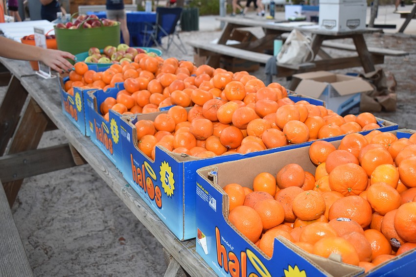 Breakfast was given to racers, like clementines and bananas.