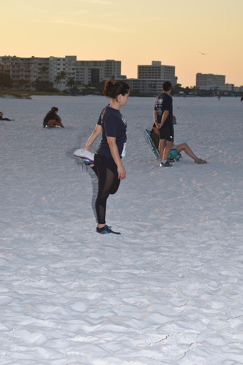 Gabriella Rocha stretches before the race.