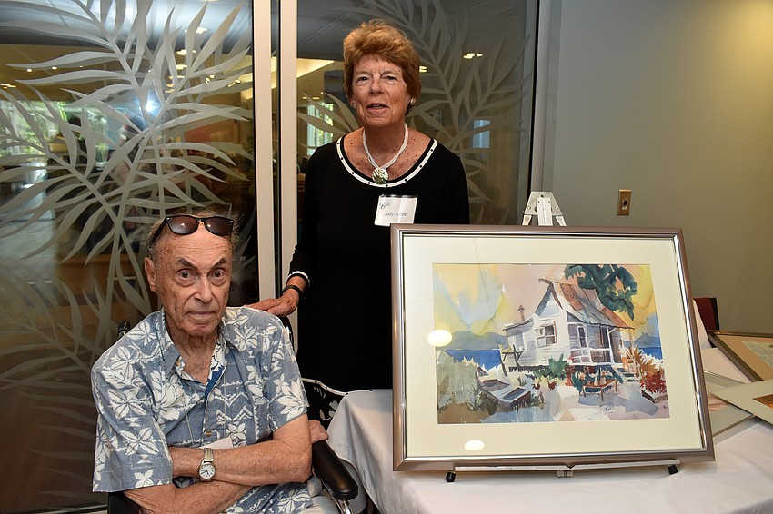 Paul and Judy Achre with Paul’s watercolor paintings