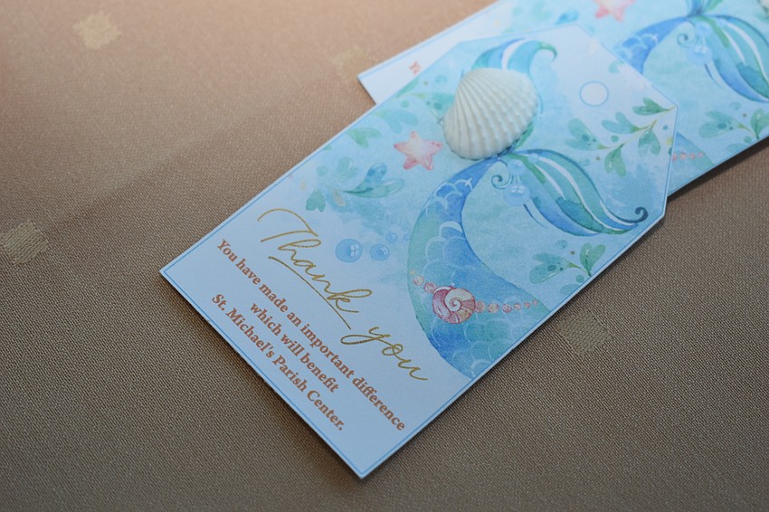 Small cards thanked the womens guild for fundraising for the new Parish center.