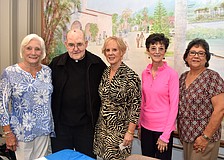 Officer Marilyn Bettencourt, Monsignor Gerry Finegan, officers Sue DiNatale, Paul Sharp and JoAnn Sifuentes