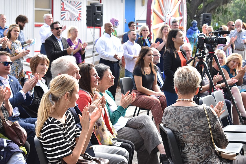 The crowd claps as Mitchell recognizes donor Marcia Jean Taub.