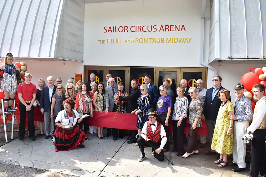 Top donors gather for the ribbon cutting.