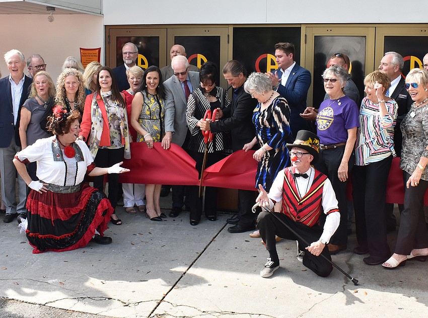 Top donors gather for the ribbon cutting.