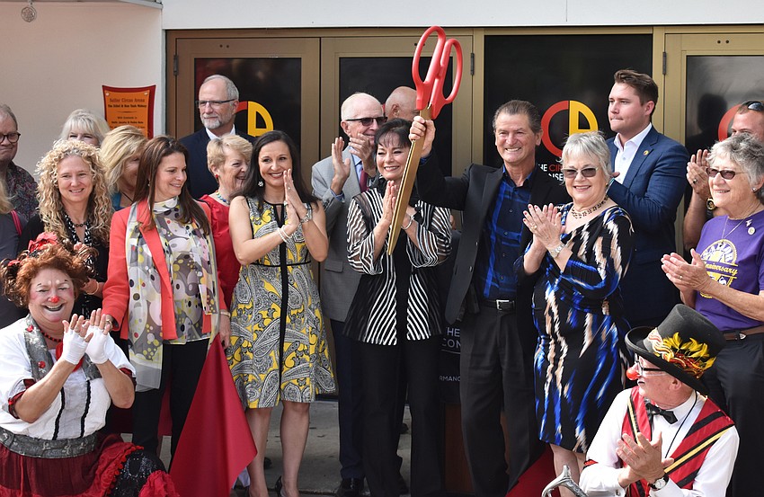 CAC Founder and CEO Pedro Reis celebrates the ribbon cutting.