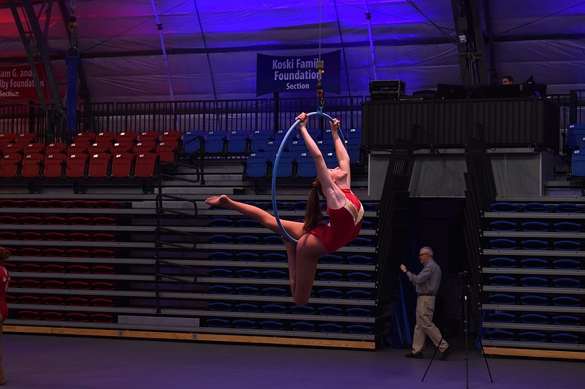 An aerial performer shows off the skills she learned from being a part of Sailor Circus.