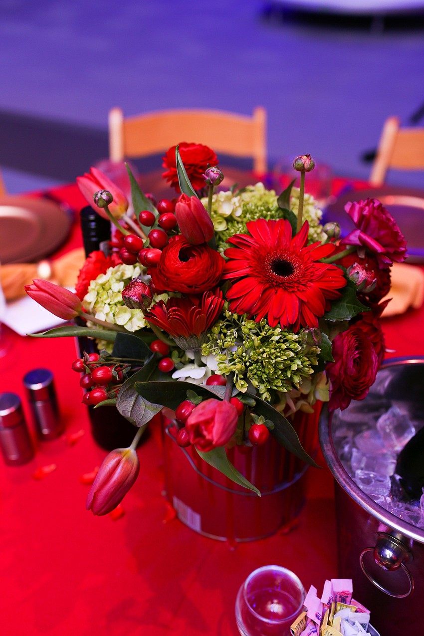 The tables were decorated in red and yellow flowers.