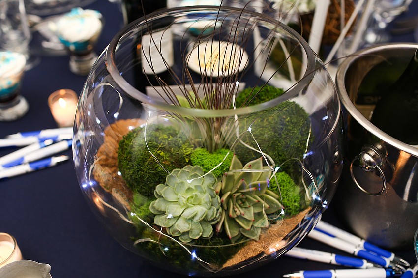 Succulents centered the tables.