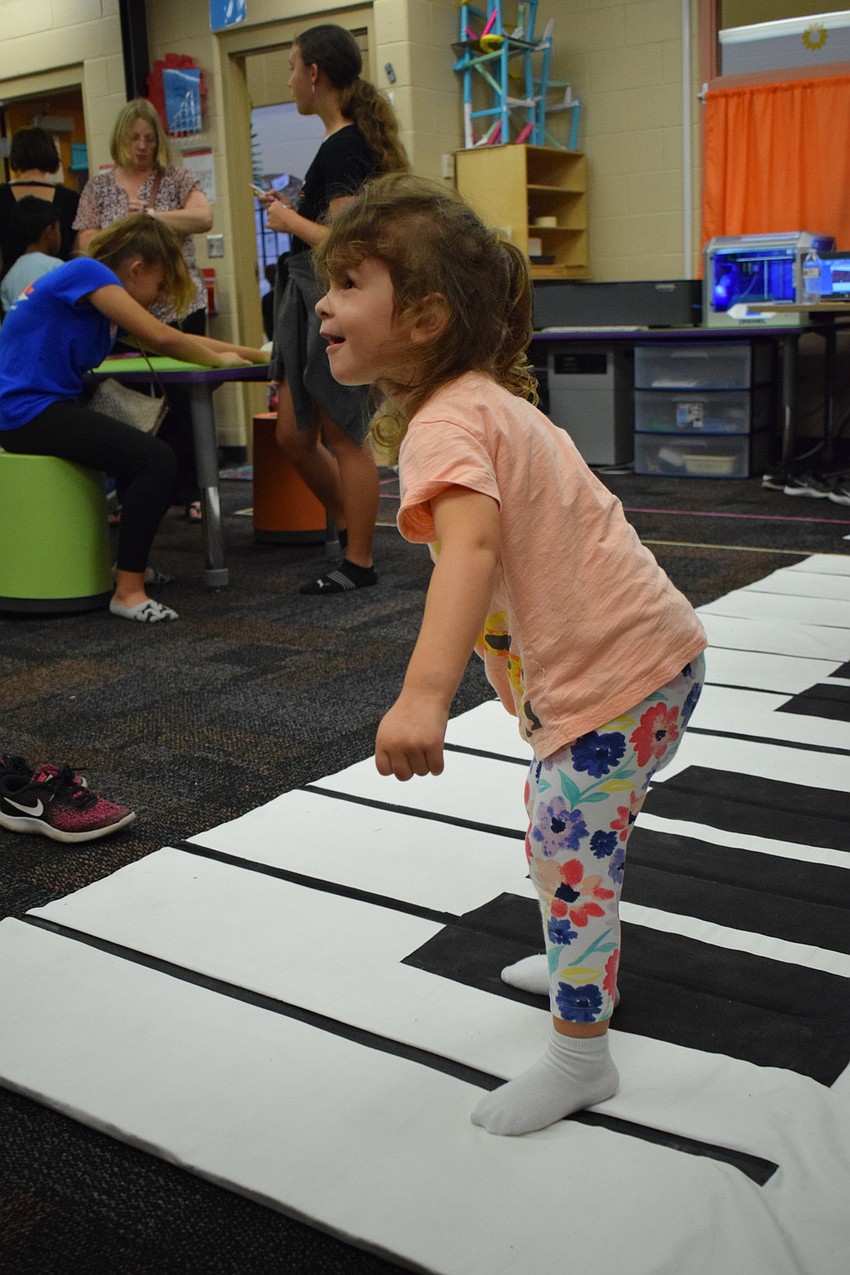 Emma Enyedi isn't old enough to be in school yet, but that didn't stop her from making music on the huge piano.