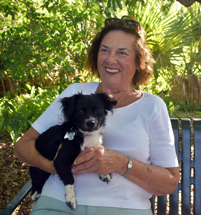 Bette Powers can't help but smile when she's holding her dog Sean.