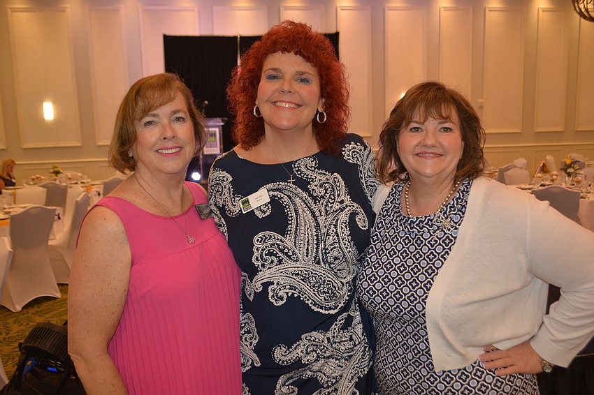 BMO Harris Bank's Jodi Allen (center) visits with The Players Centre's Donna DeFant and Morgan Gerhart before the fashion show began.