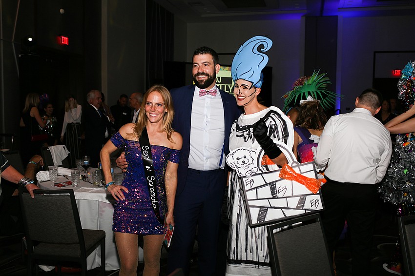 Stacy Keck, Ross Johns and Megan Metcalf pose for a photo.