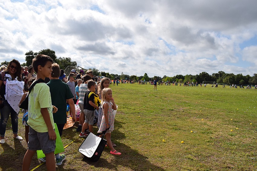 Children lined the soccer fields at Greenbrook Adventure Park in anticipation of the Easter Egg Hunt.