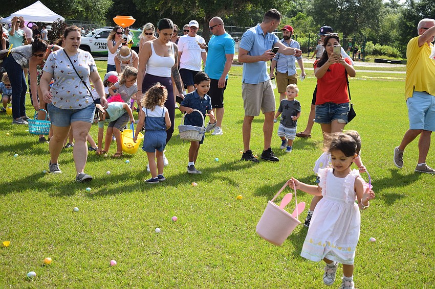 Parents trailed behind the children flying across the field.