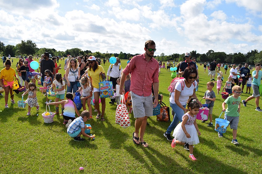 Some parents helped pick up eggs with the younger children.