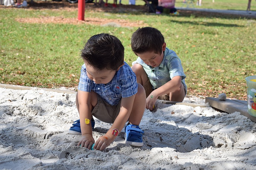 Benjamin and Davis Caldwell, of Sarasota Springs, repurposed some of the empty eggs as tools to dig in the sand.