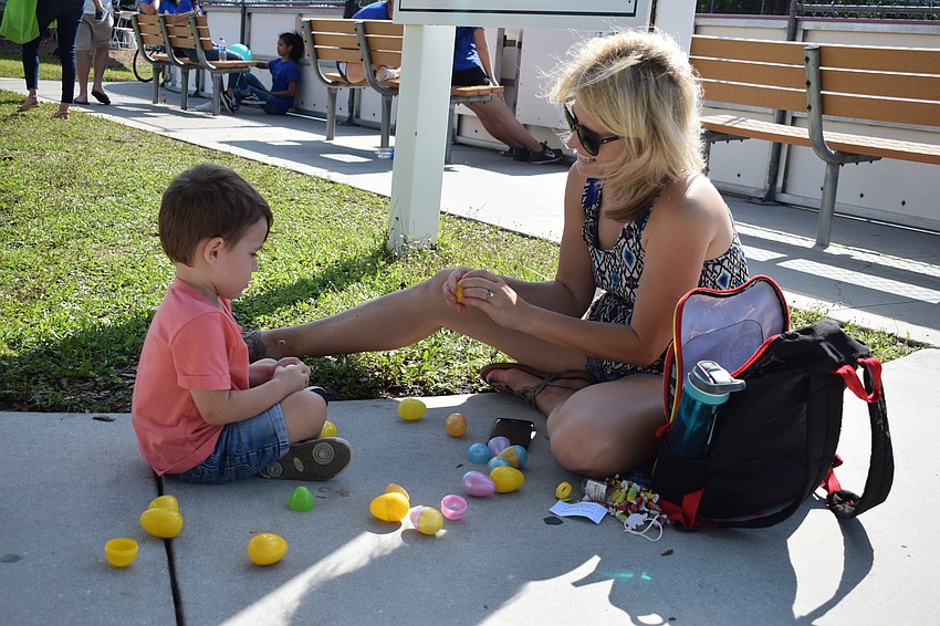 Donna Moore, of Cypress Creek Estates, helped her son, Mason Moore, open and count his eggs.