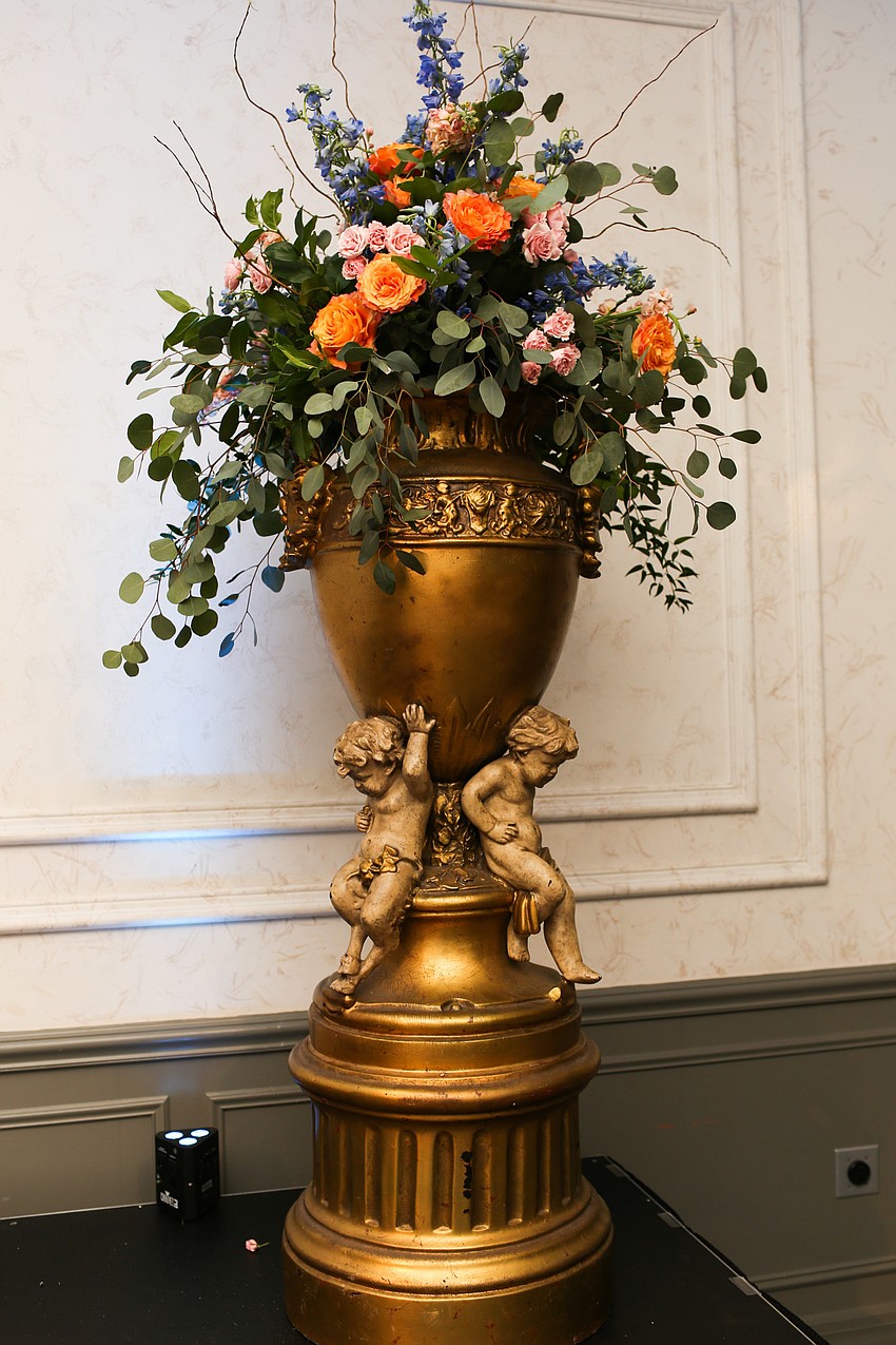 A tall vase stood on the stage.