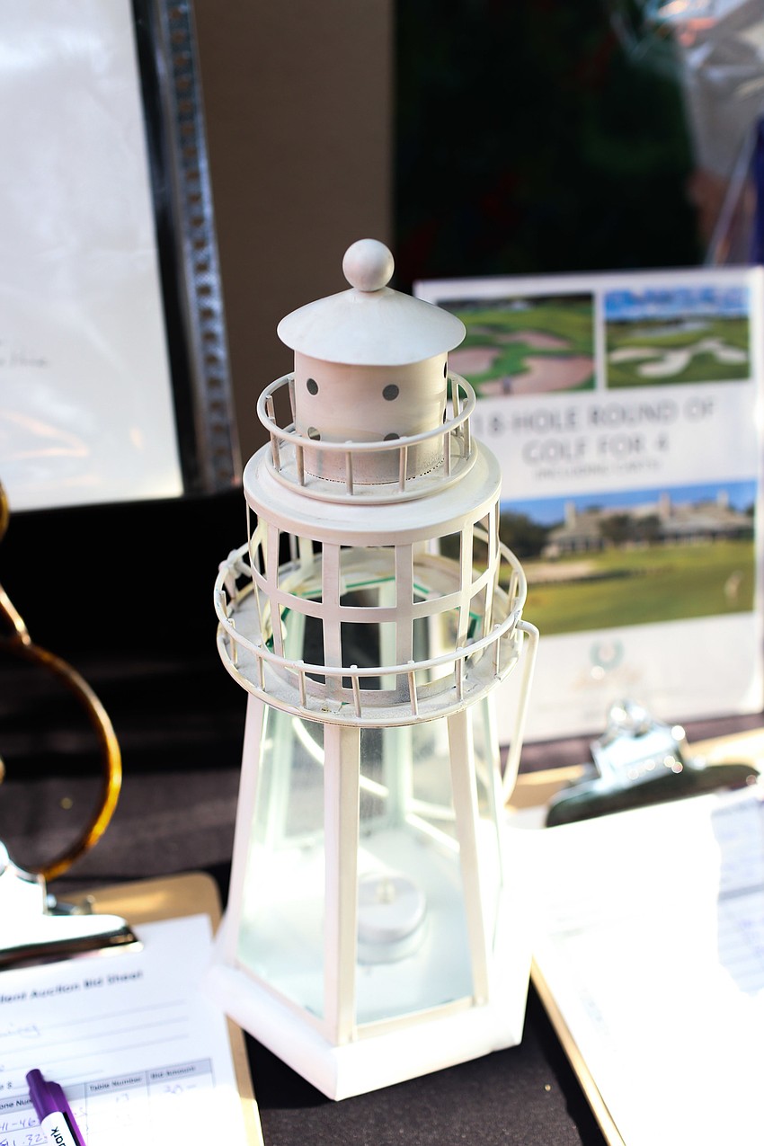 Lighthouses decorated the silent auction and cocktail tables.