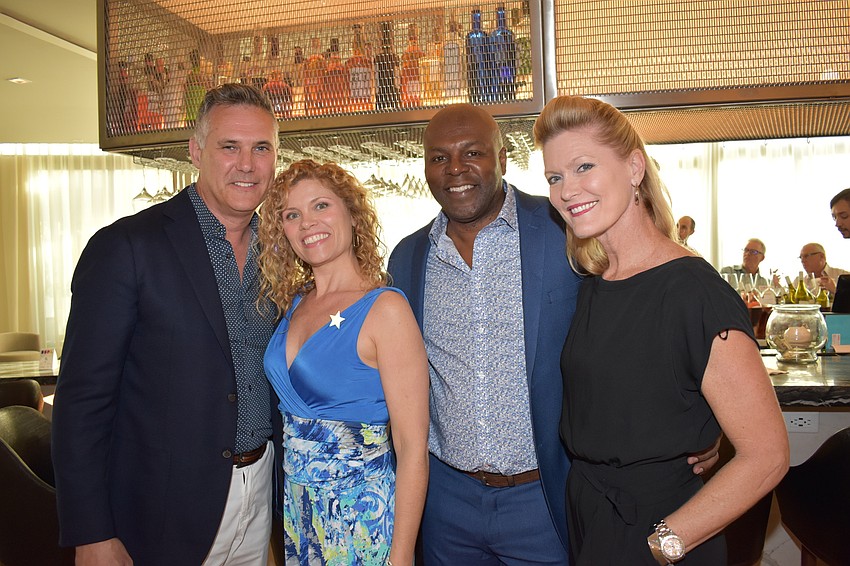 Trevor and Sylvia Dolan with Malele Nzeza and Southside Elementary principal Jennifer Nzeza