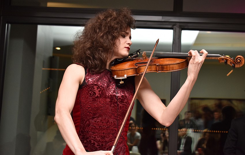 Violinist Sandy Cameron played for the fundraiser towards the end of the night. Photo by Niki Kottmann.