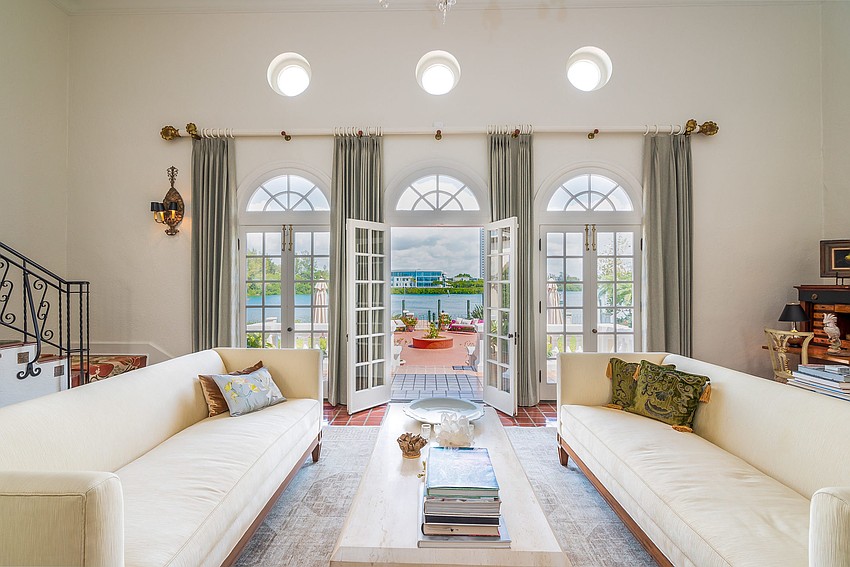 The living room features French doors that open onto the back patio.