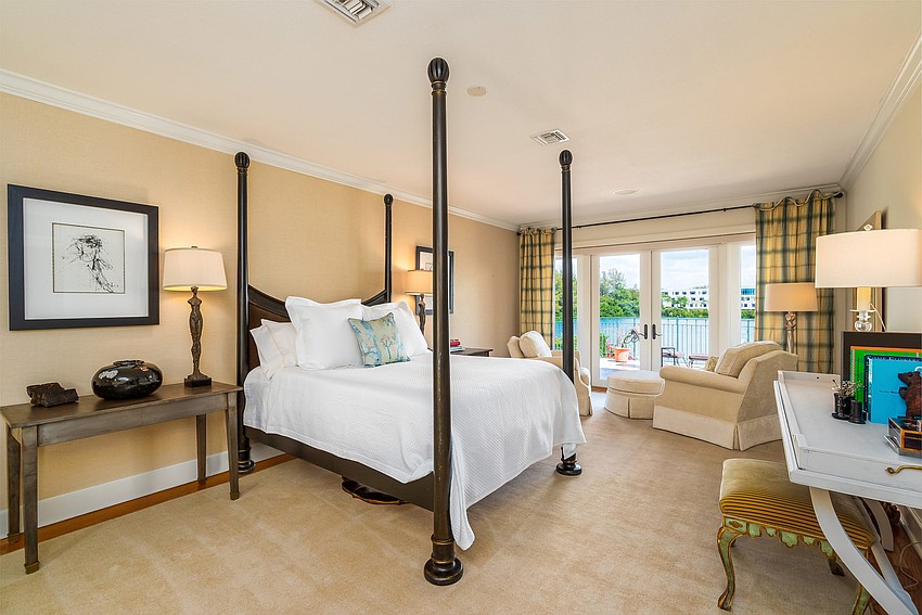 The master bedroom opens to a balcony that overlooks Sarasota Bay.