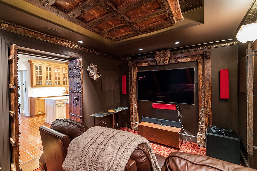 One of the rooms in the home has been converted into a theater.
