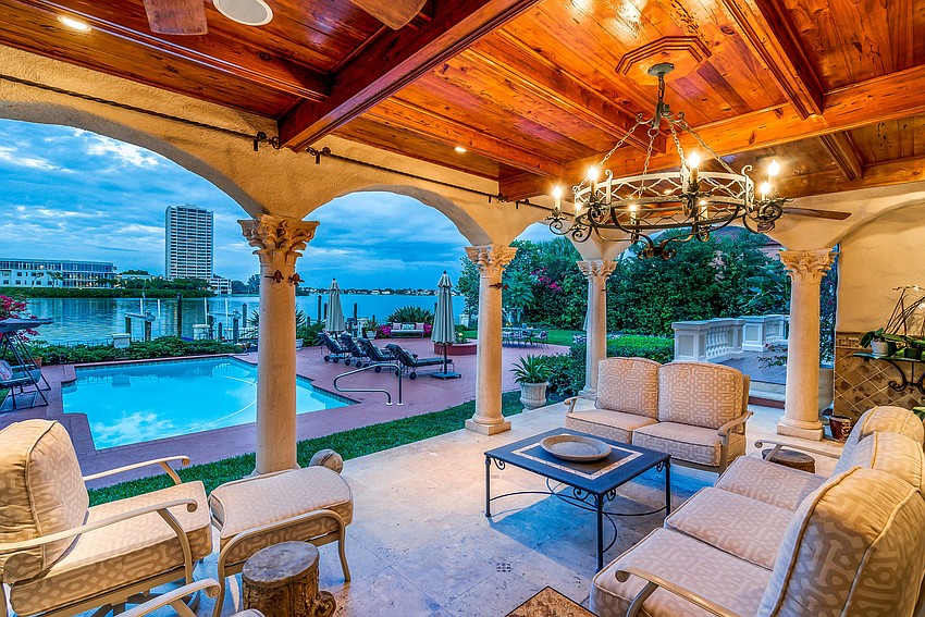 The home features a patio, pool and fountain outside.