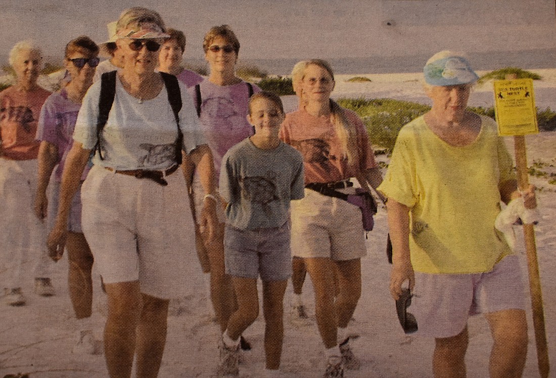 A group patrols the beach in 2000, which is what the volunteers continue doing today.