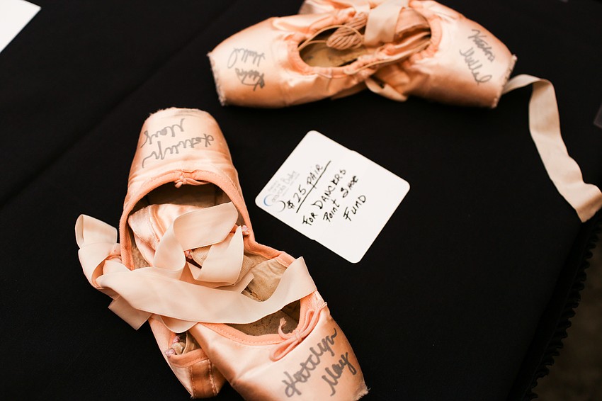 Signed ballet shoes were on sale, and proceeds went towards the dancers pointe shoe fund.