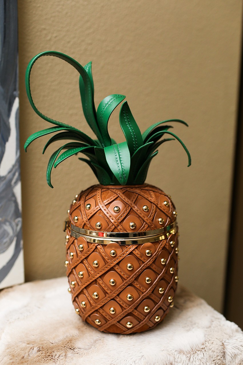 Phillips showed off this pineapple Kate Spade purse at Shine On! 2019.