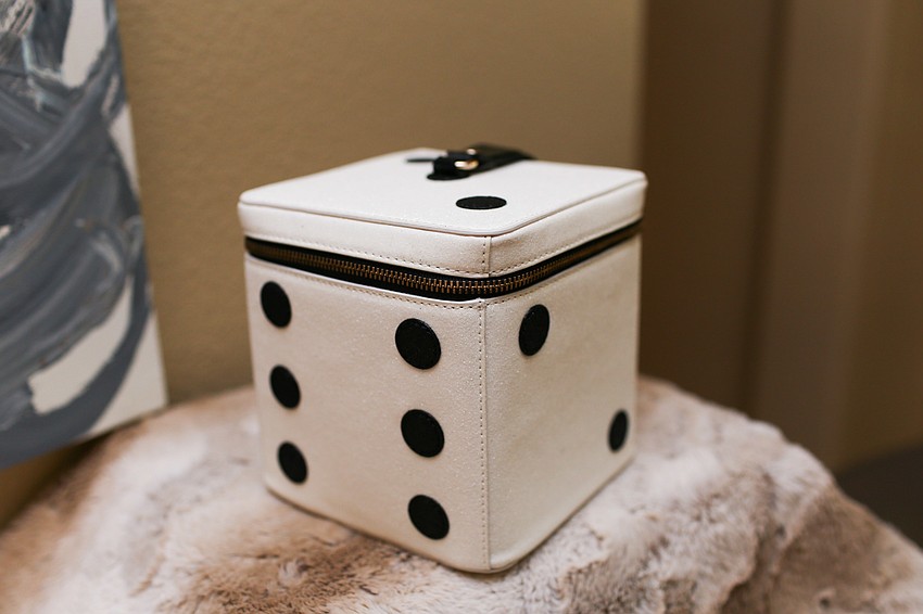 Phillips sported this Kate Spade dice purse at Banyan Ball 2018.