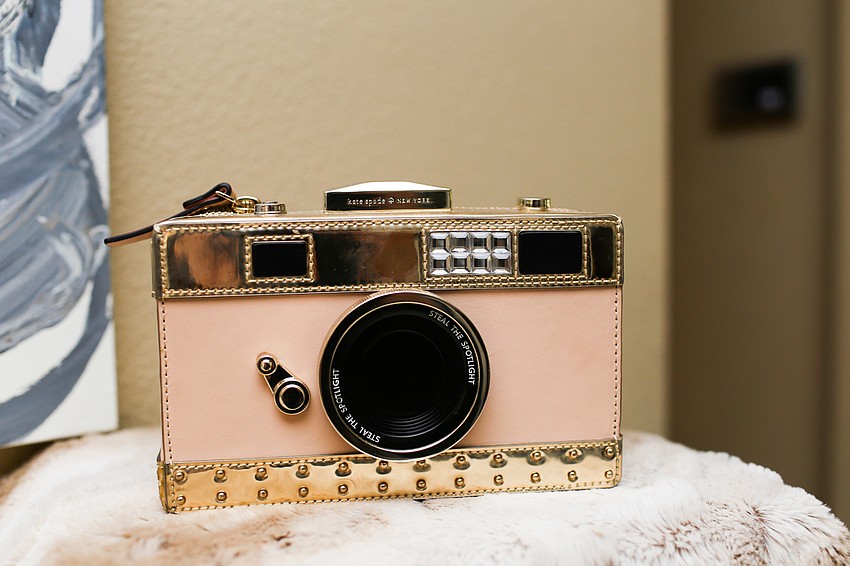 All of Phillips' uniquely shaped purses are Kate Spade products.