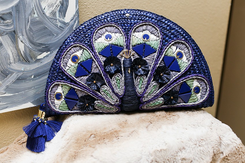 Phillips rocked this peacock Kate Spade purse at a 2019 Easterseals Luncheon.