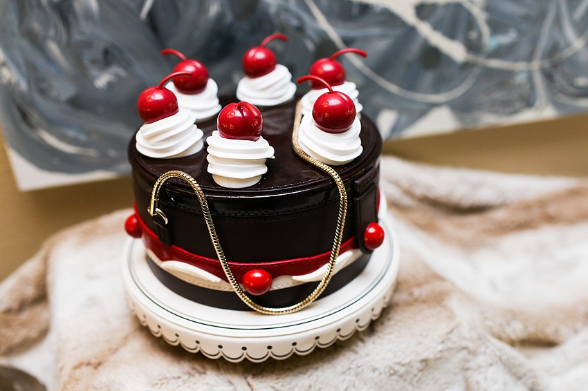 Phillips donned this Kate Spade cake purse at Wine, Women & Shoes 2017 .