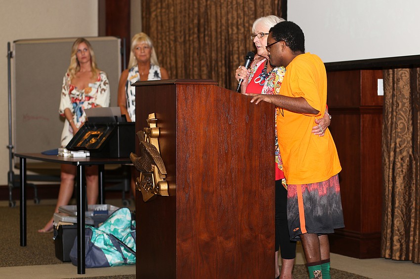 Seth Winners and Kathryn Shea  tell guests about The Haven Sarasota.