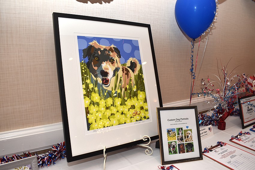 During cocktail hour, guests could bid on silent auction items, such as custom dog portraits.
