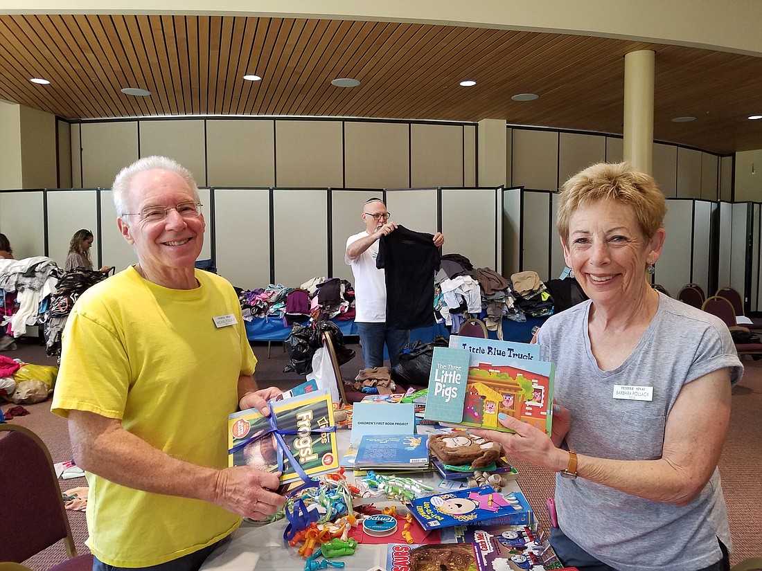 Barbara and Mike Pollack make reading packets for Booker Elementary. Courtesy Photo.