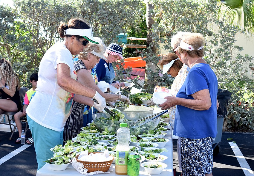 Along with pizza, some residents put together salad for their neighbors.