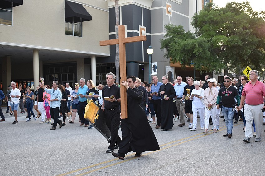 Christoph Stephenson-Moe carried the cross in front of the procession.