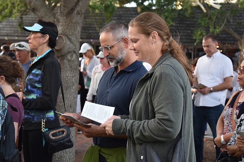 Jamie and Allison Lerario follow along in the book.