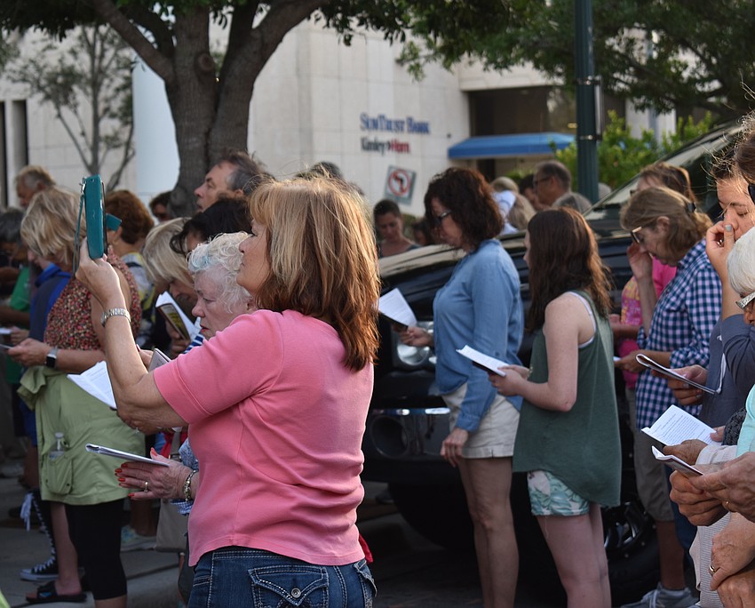 Barbara Kaberna records one of the stations on her phone.
